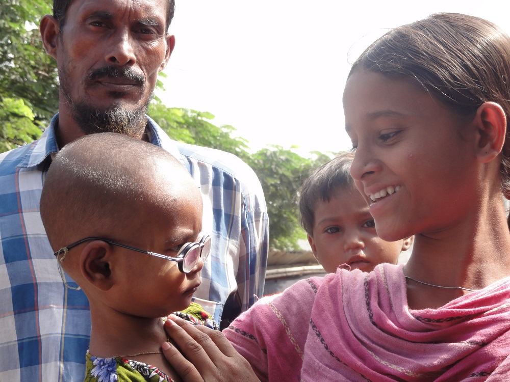 A 4 year old with a pair of glasses provided as part of BRAC's urban ultra poor program.