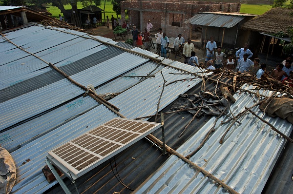 Solar panels are seen installed on the roof of a village grocery store in Khasha Hazipur of Badarganj Upazile in Rangpur district, Bangladesh. (Photo: BRAC/Shehzad Noorani)