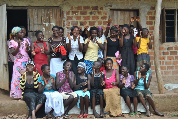 Members of the Joyce Nagendo ELA club in Kyevunza, Uganda, celebrate together.